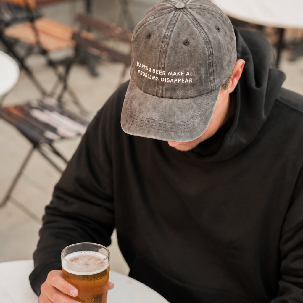 black-denim-cap-barks-and-beer-make-all-problem-disappear-man-wearing.png